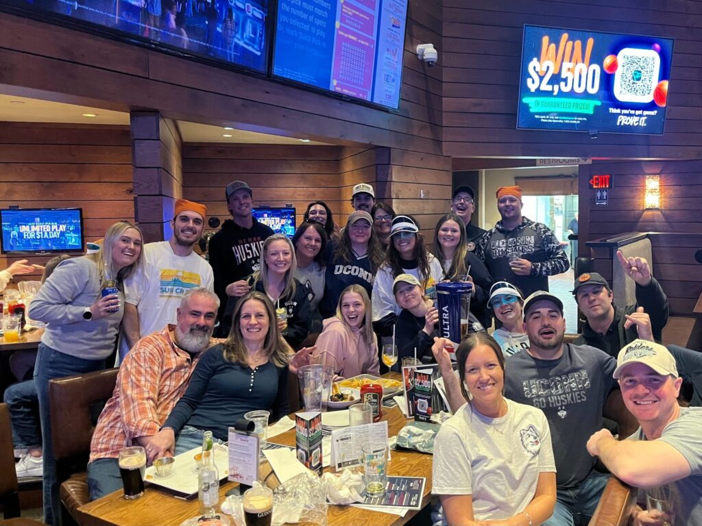 Fans celebrating at a March Madness watch party at Bobby V’s Stamford